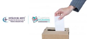 Mano insertando en voto en una urna de votación.